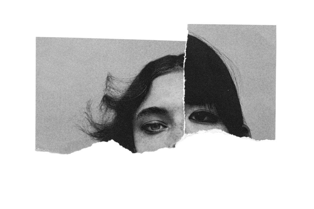 Creative collage of torn paper showing a woman's eyes in monochrome example of surrealism.